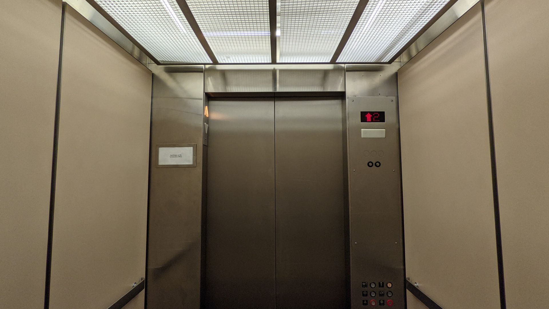 A vintage Montgomery hydraulic elevator interior that has a modified controller and interior at Macy's Westfield Montgomery in Maryland.