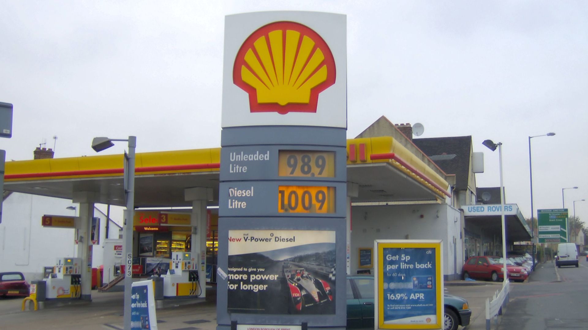 A UK Shell petrol station in London in October 2007, listing the unleaded price as 98.9p a litre and the diesel price as 100.9p a litre. The picture was taken as the price of petrol in the UK began to rise above £1 a litre (100p), and shortly after the pr
