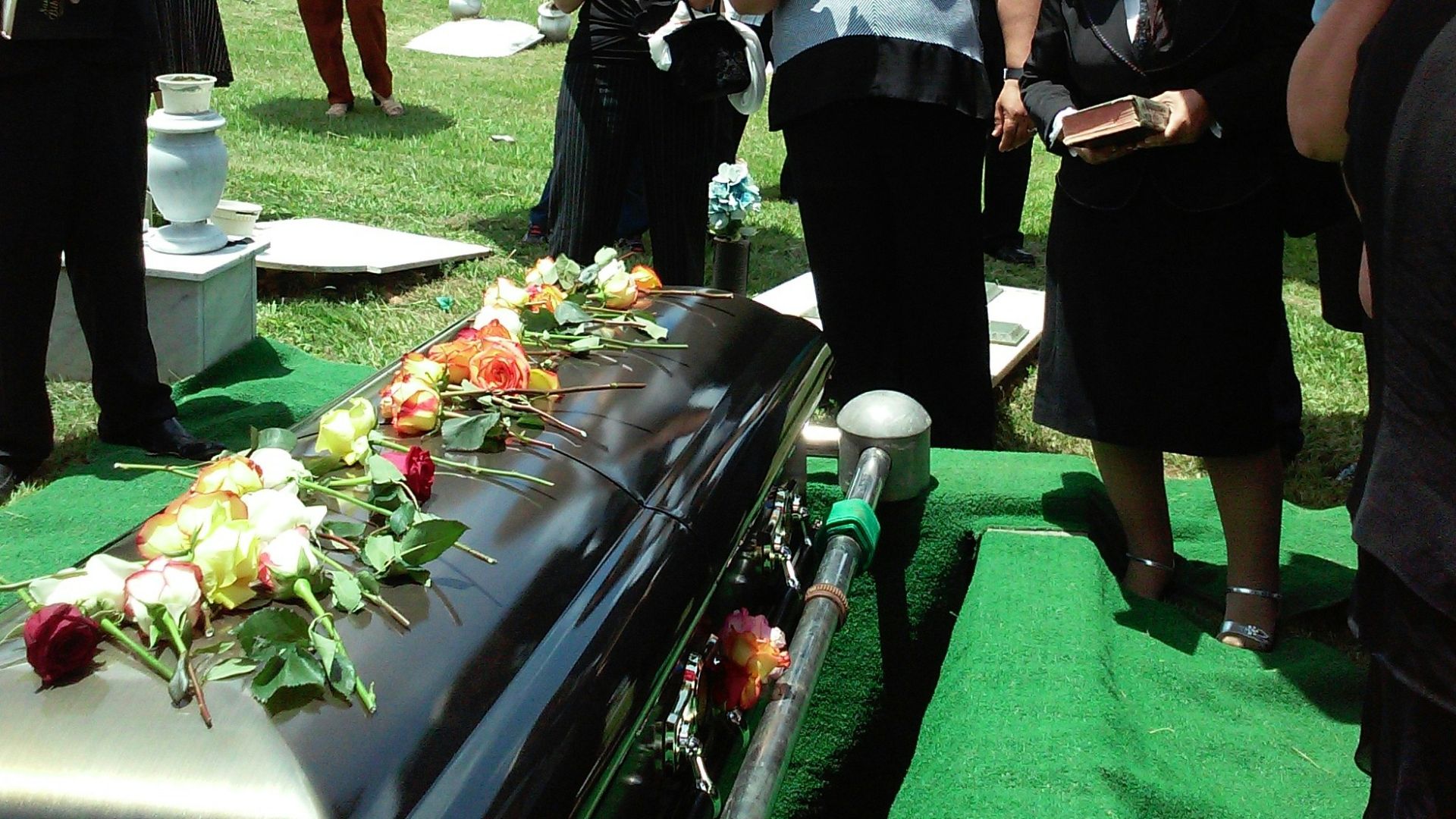 group of people attending burial