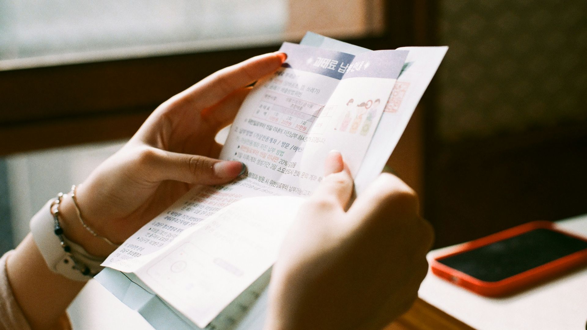 person holding white printer paper