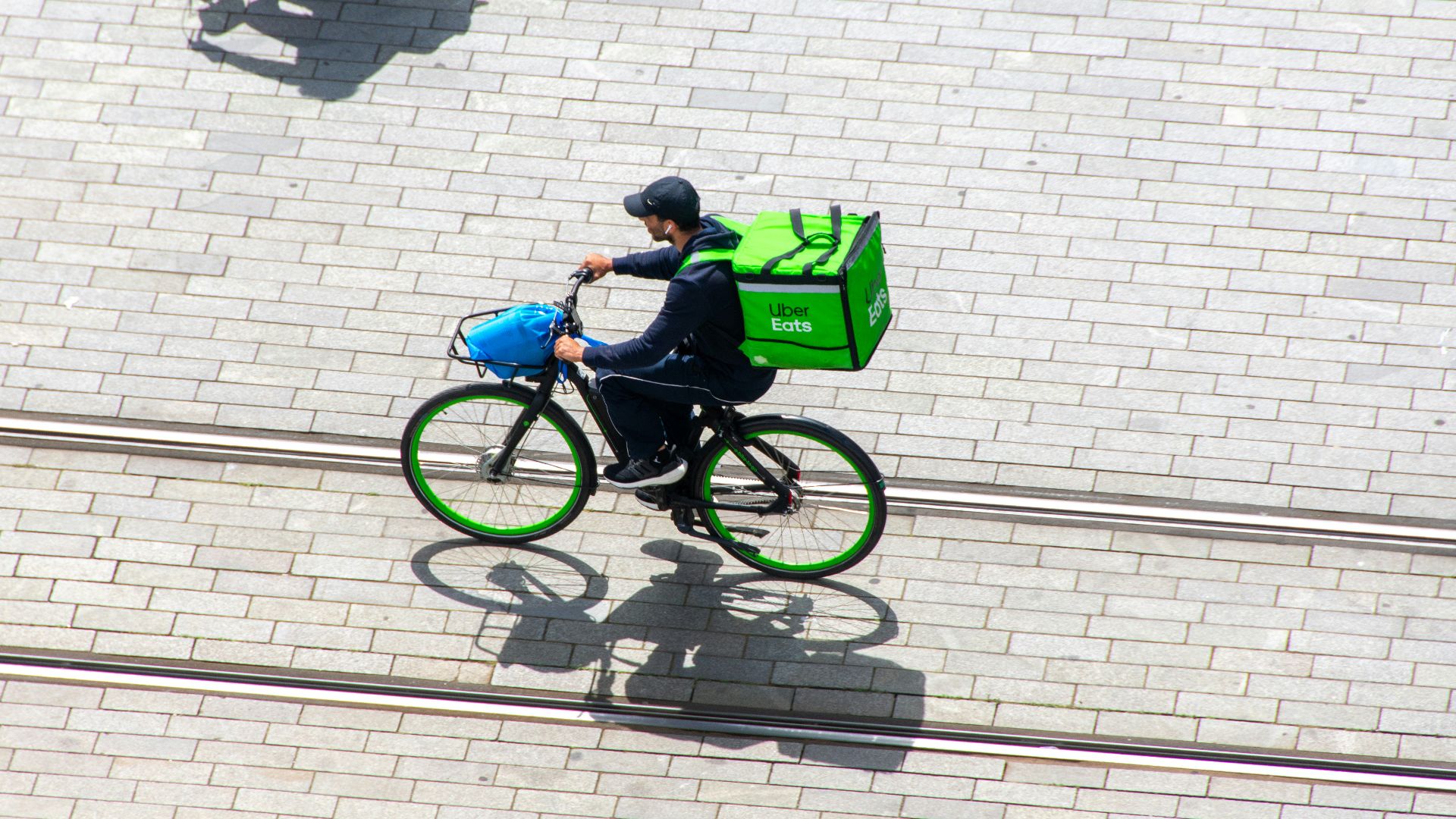 a man riding a bike down a street