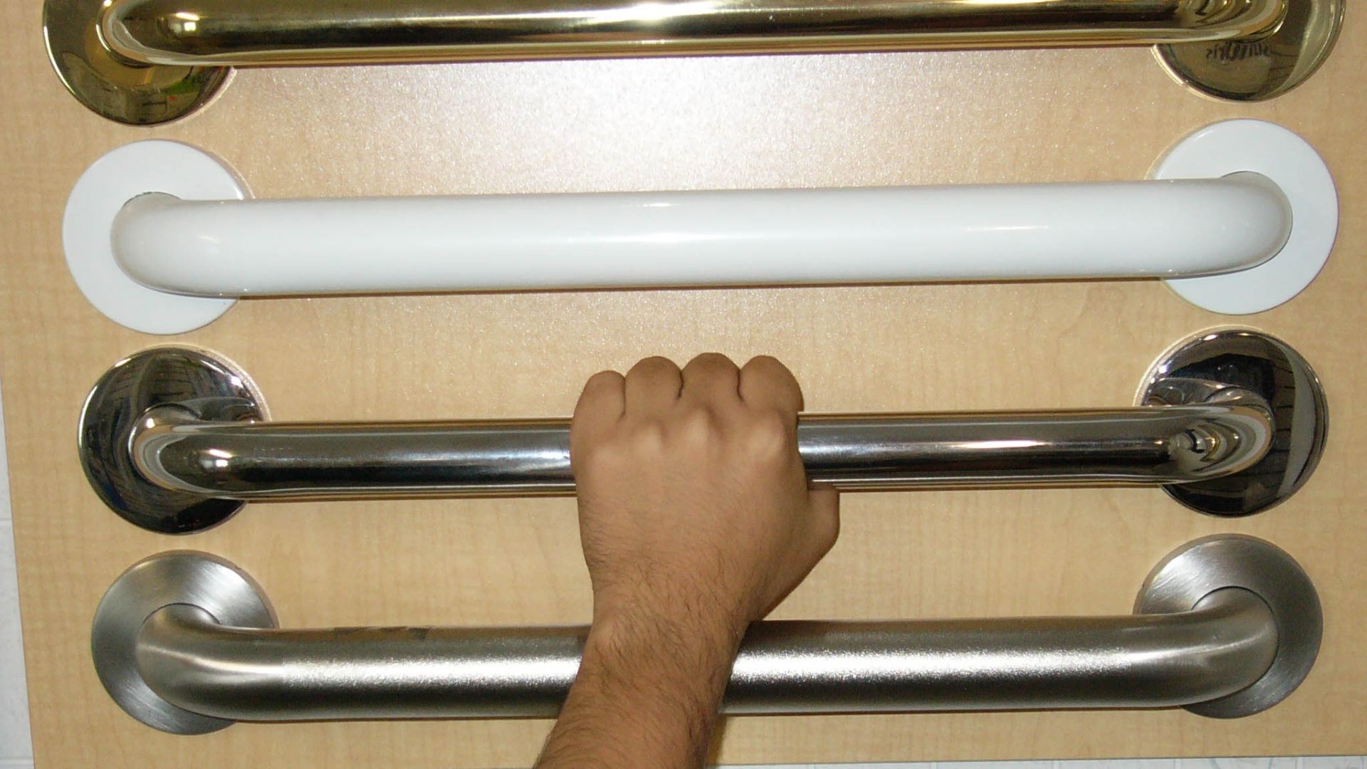 This photo was taken at the Master Grab Bar showroom in Lewes, Delaware as a customer was feeling the different textures on their grab bars.