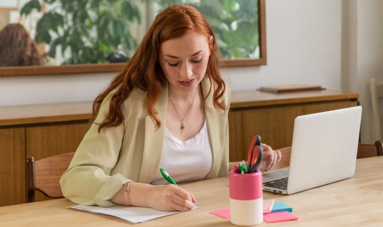 woman writing something 