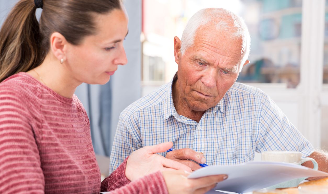Shutterstock-1524553115, Sad young woman and father with financial documents at home interior