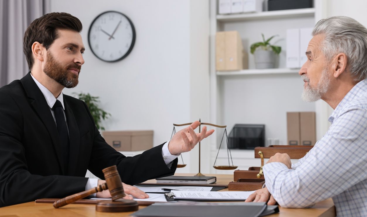 Shutterstock-2436548439, Senior man having meeting with lawyer in office