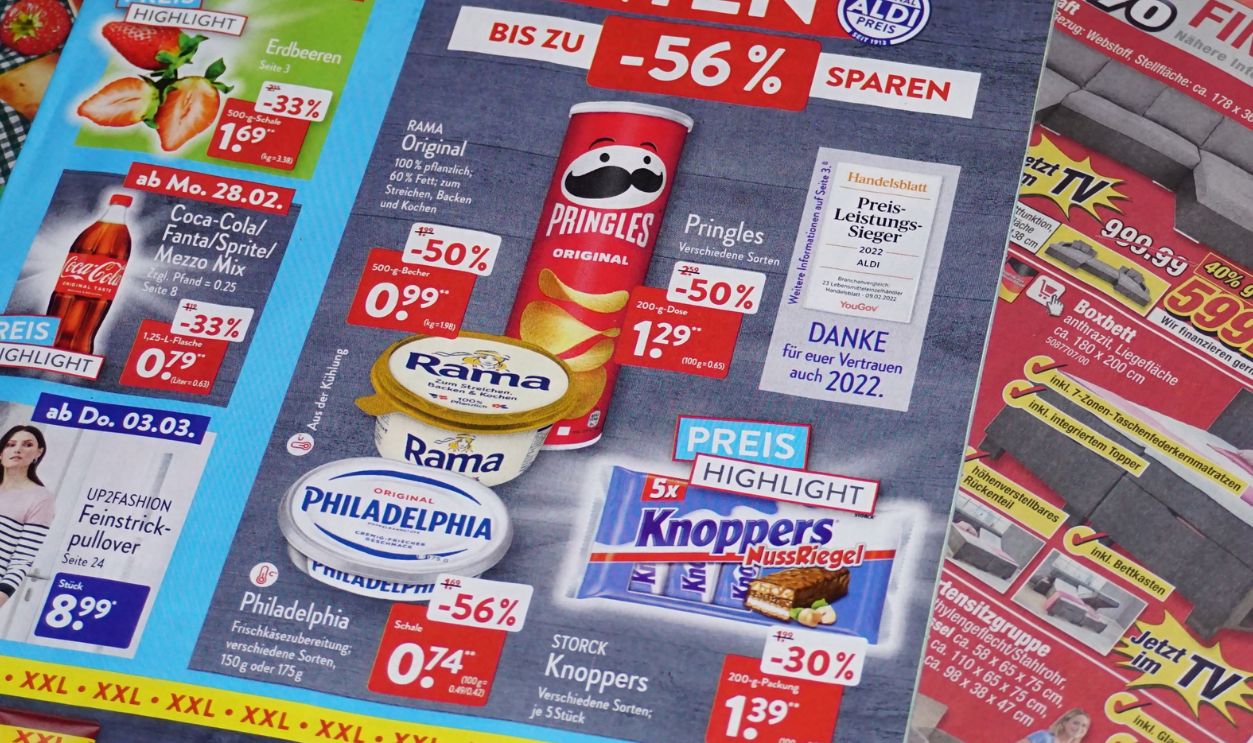 Delligsen, Germany, March 1st, 2022 - Shot of weekly printed advertising supplements from Aldi, Rewe, Edeka and Toom Baumarkt