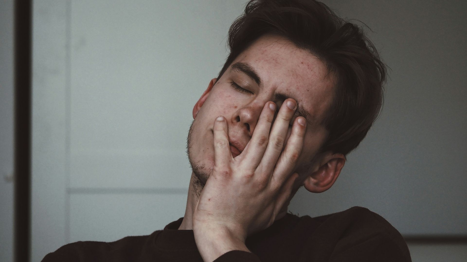man wearing black crew-neck top