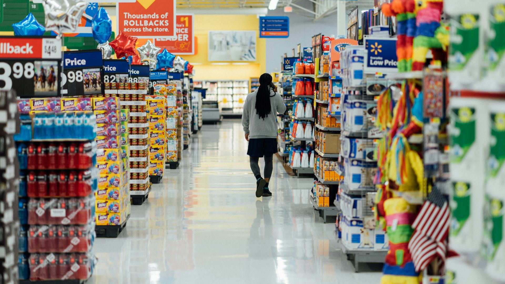 person standing between shelvings