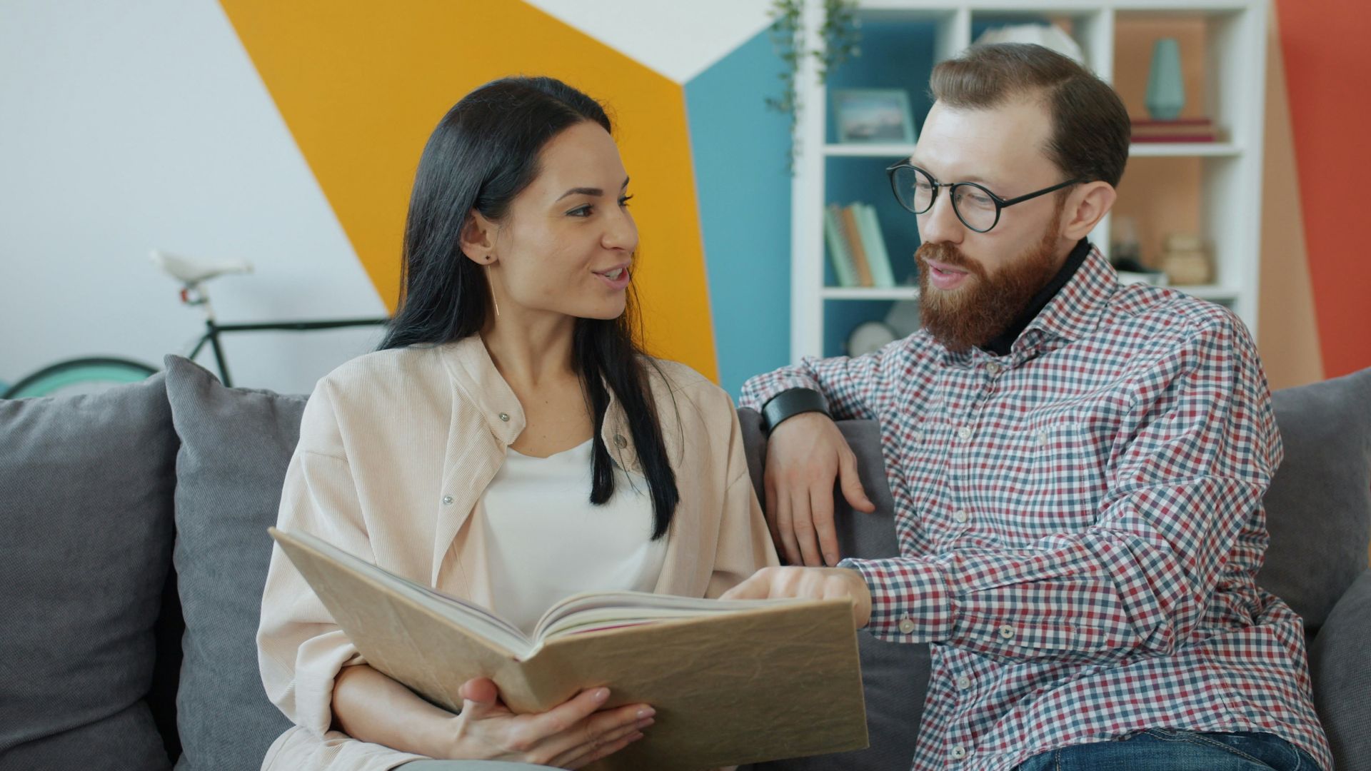 Couple looking at an open photo album together