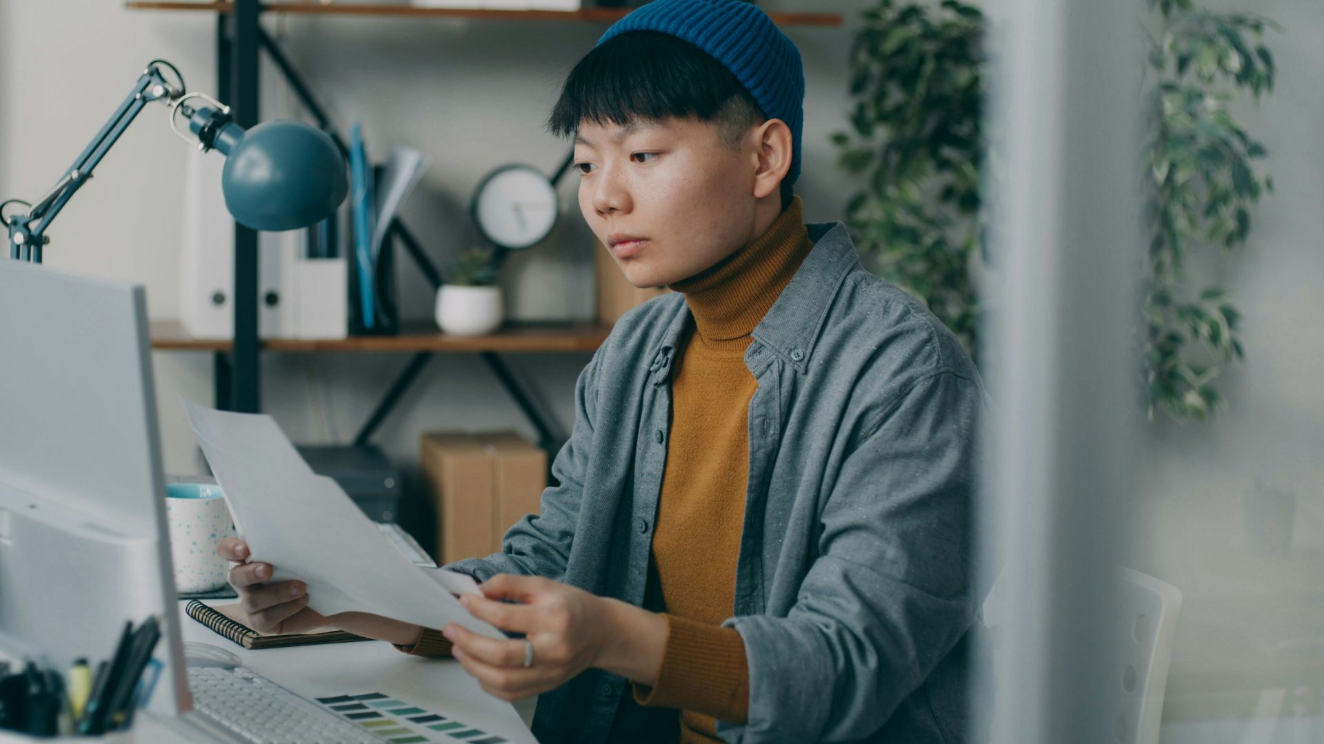 A person sitting at a desk with a computer