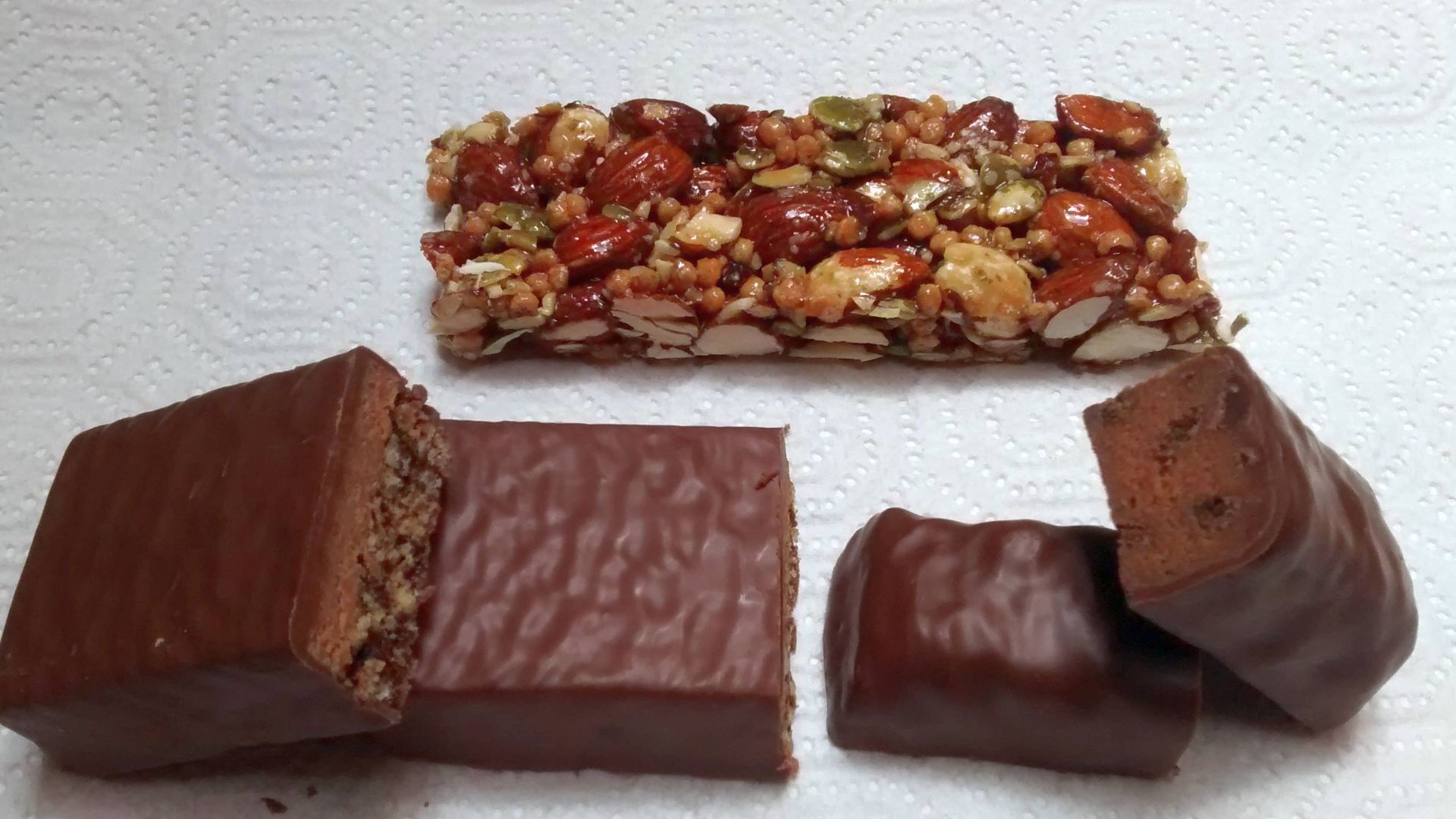 Top: STRONG & KIND Hickory smoked almond protein bar made by Kind (company)
Left: Clif Chocolate Mint Builder's Bar made by Clif Bar & Company

Right: LUNA Protein Mint Chocolate Chip bar made by Clif Bar & Company