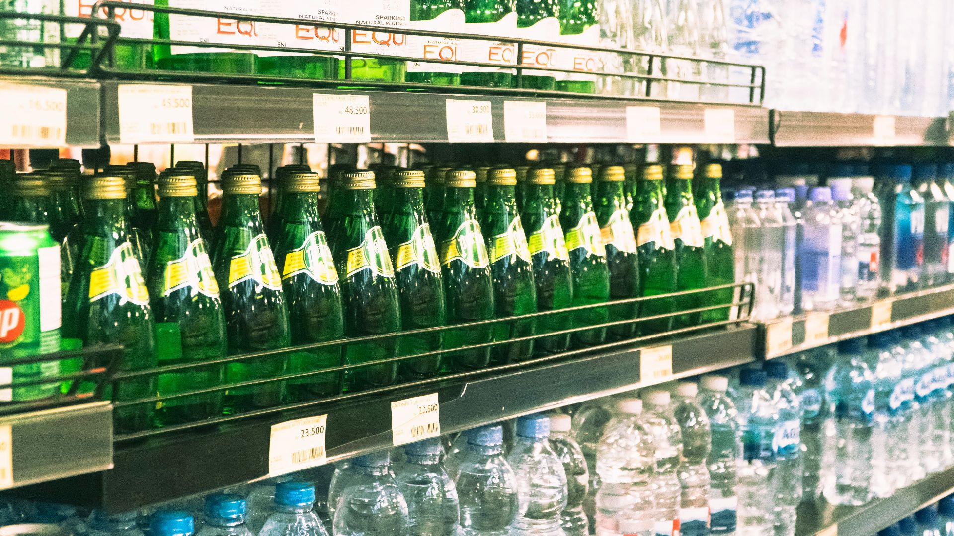 a display in a store filled with lots of bottles of water