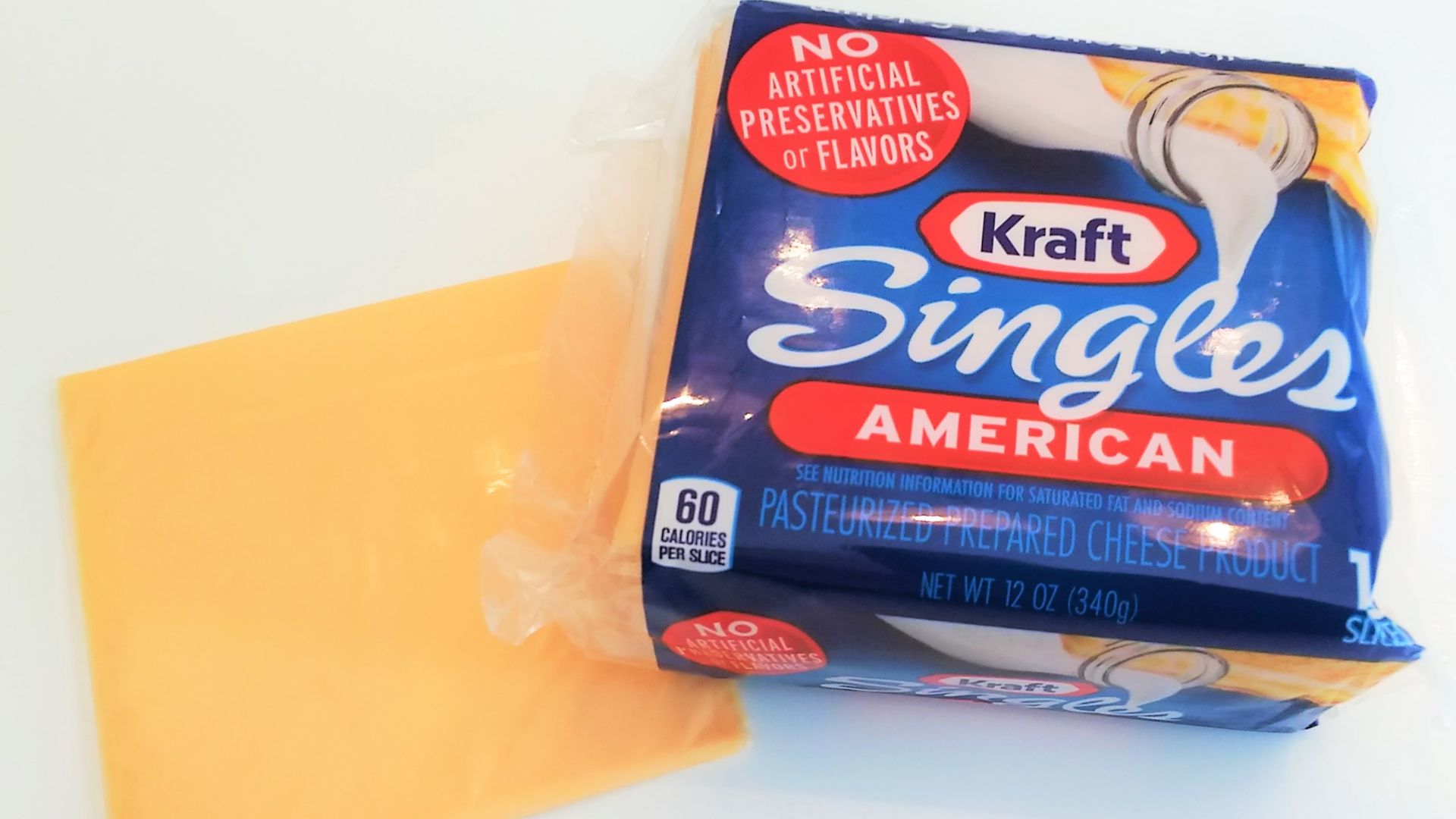 A package of Kraft Singles along with an individual slice.