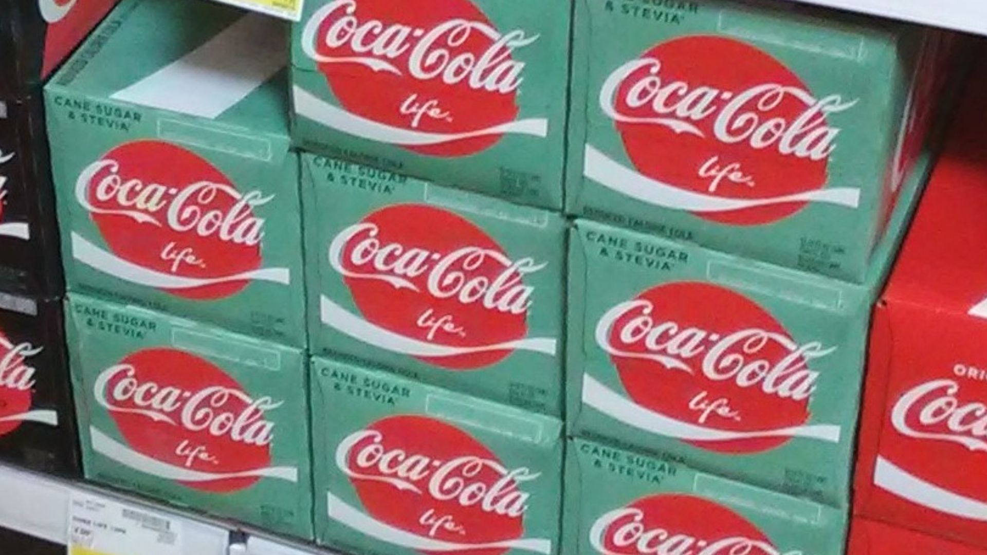 A stack of Coca-Cola 12 pack on a grocer shelf in April 2019 on store shelf in the United States