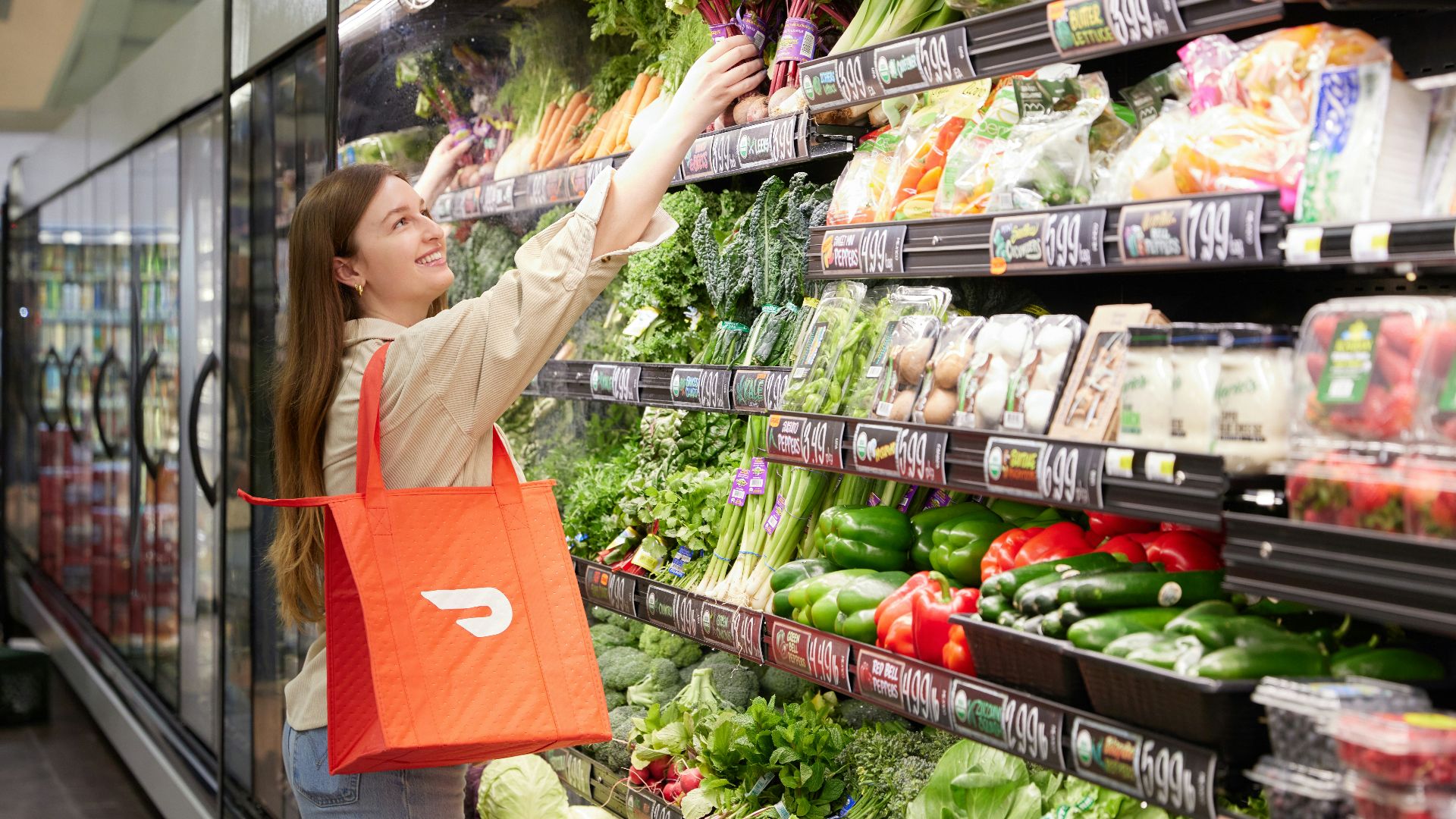 a woman is shopping in a grocery store