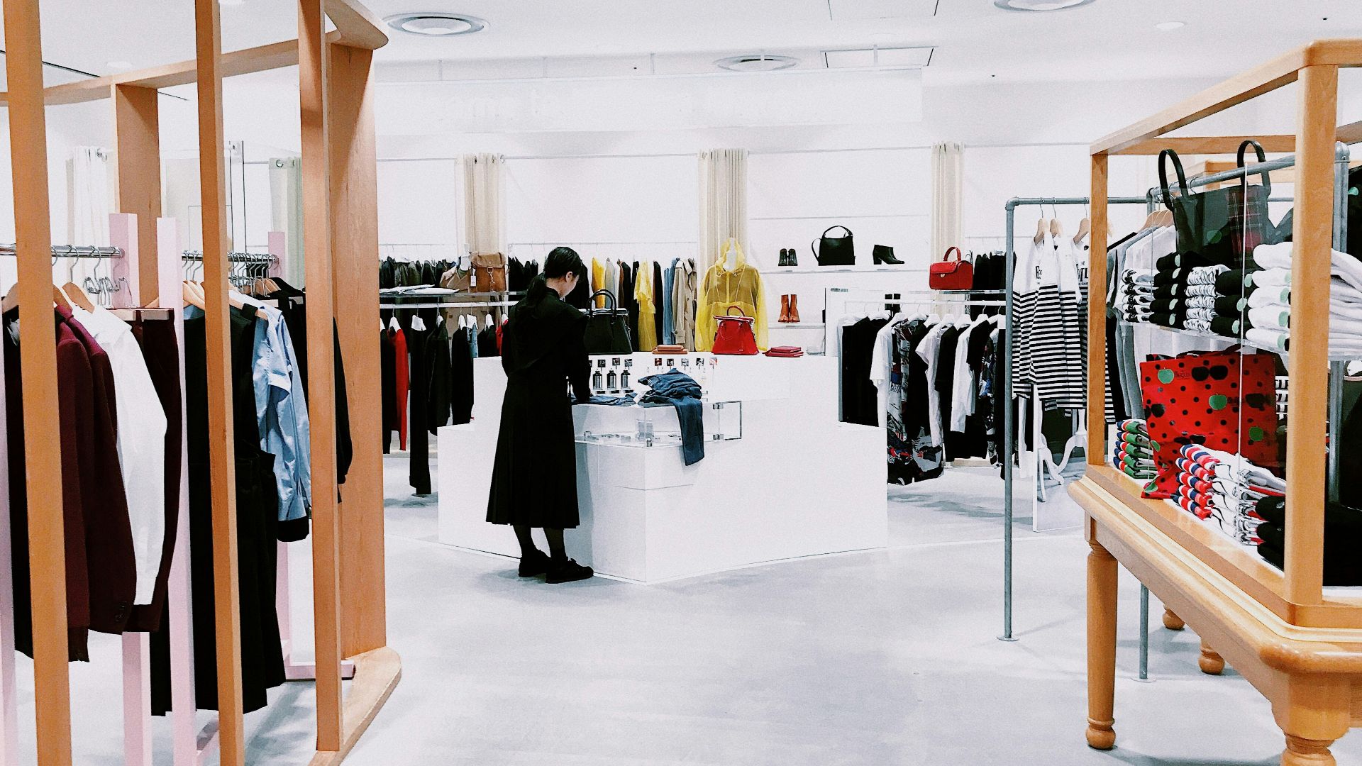 woman standing inside clothing area