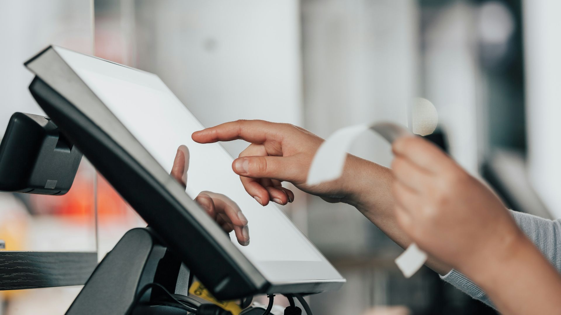 a person is using a pos machine in a store