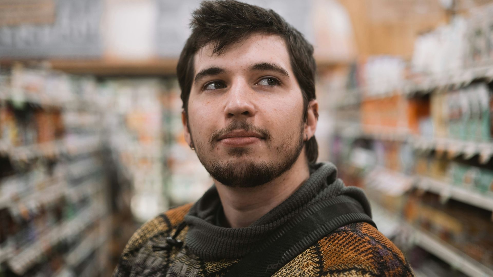 a man standing in a grocery store aisle