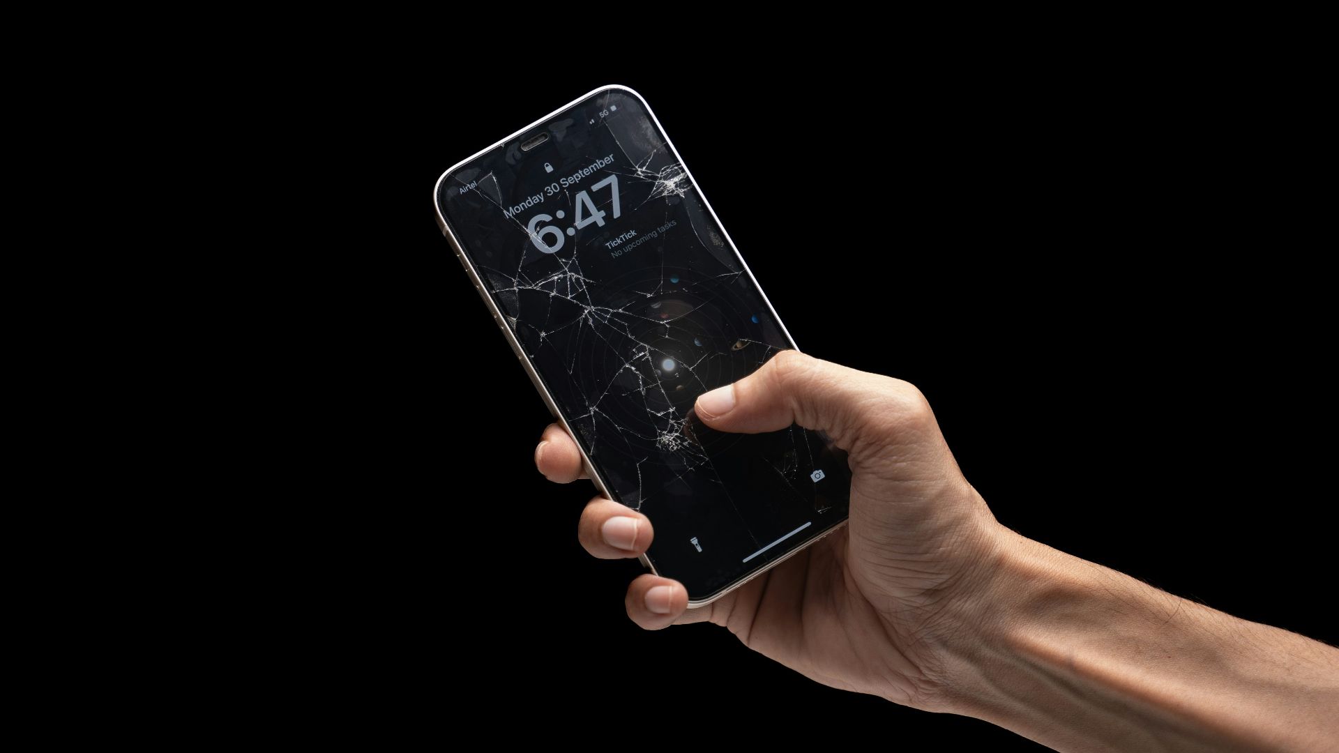 A person holding a cell phone in their hand