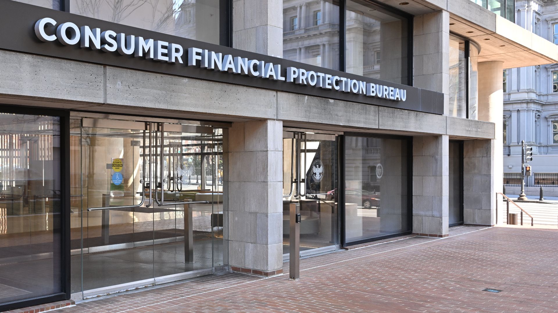 The entrance to the Consumer Financial Protection Bureau headquarters with the bureau's name above it. 1700 G Street NW, Washington, DC 20552.