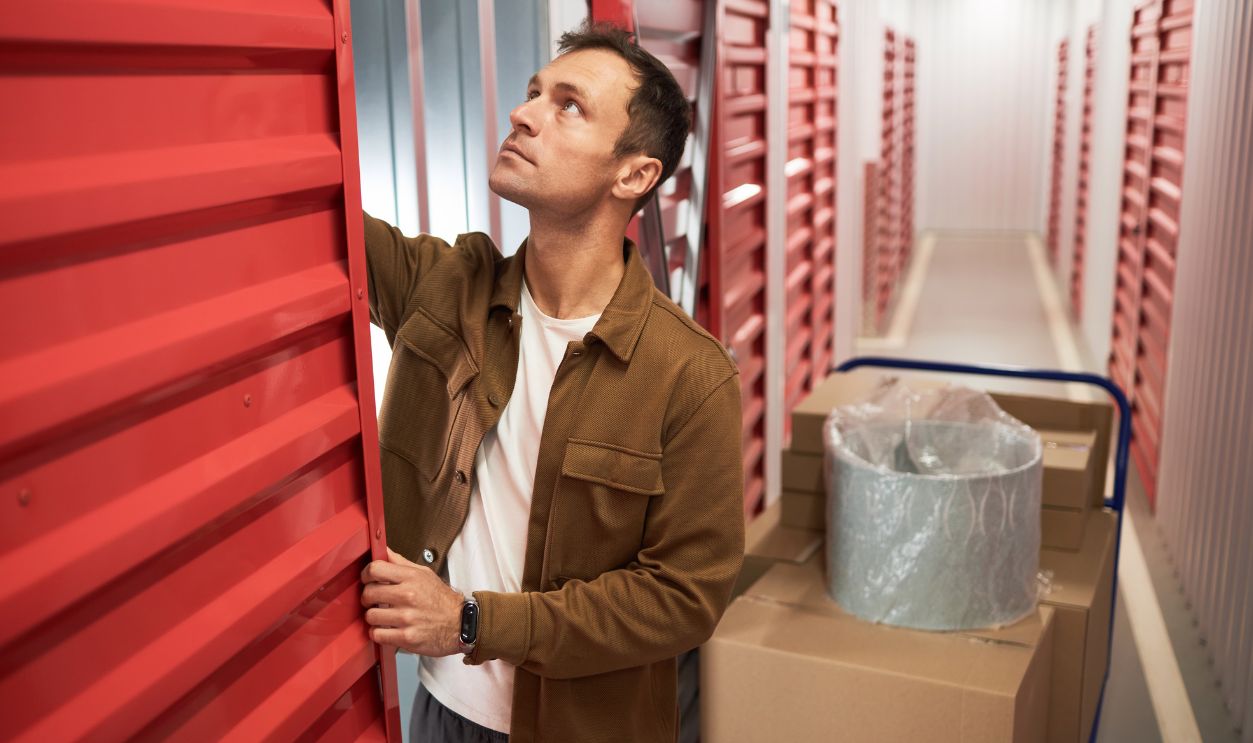Man Opening Door of Storage Unit