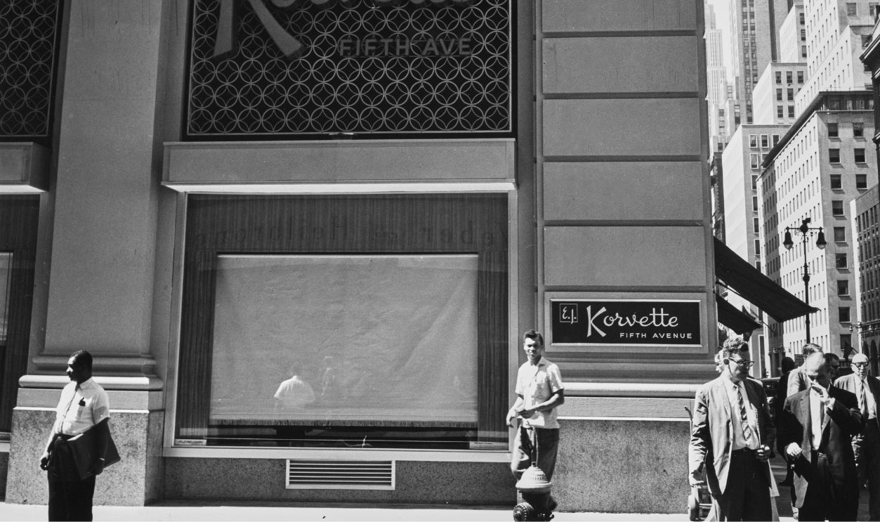 Pedestrians on the street outside the 'EJ Korvette' department store on Fifth Avenue, Manhattan, New York City, New York, circa 1965.