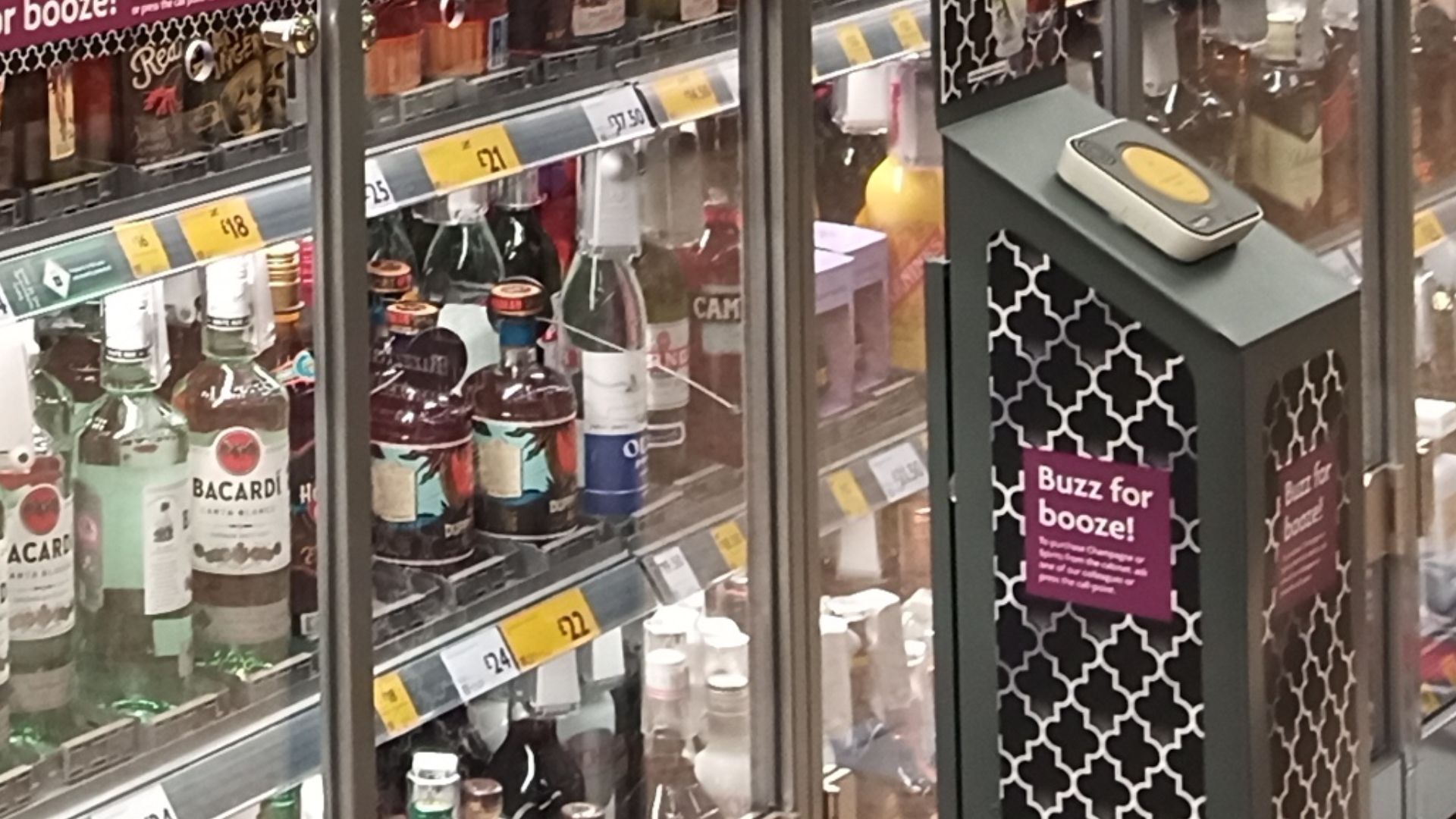 Behind glass, spirits now locked away at Morrisons, Pontefract (West Yorkshire), England, GB