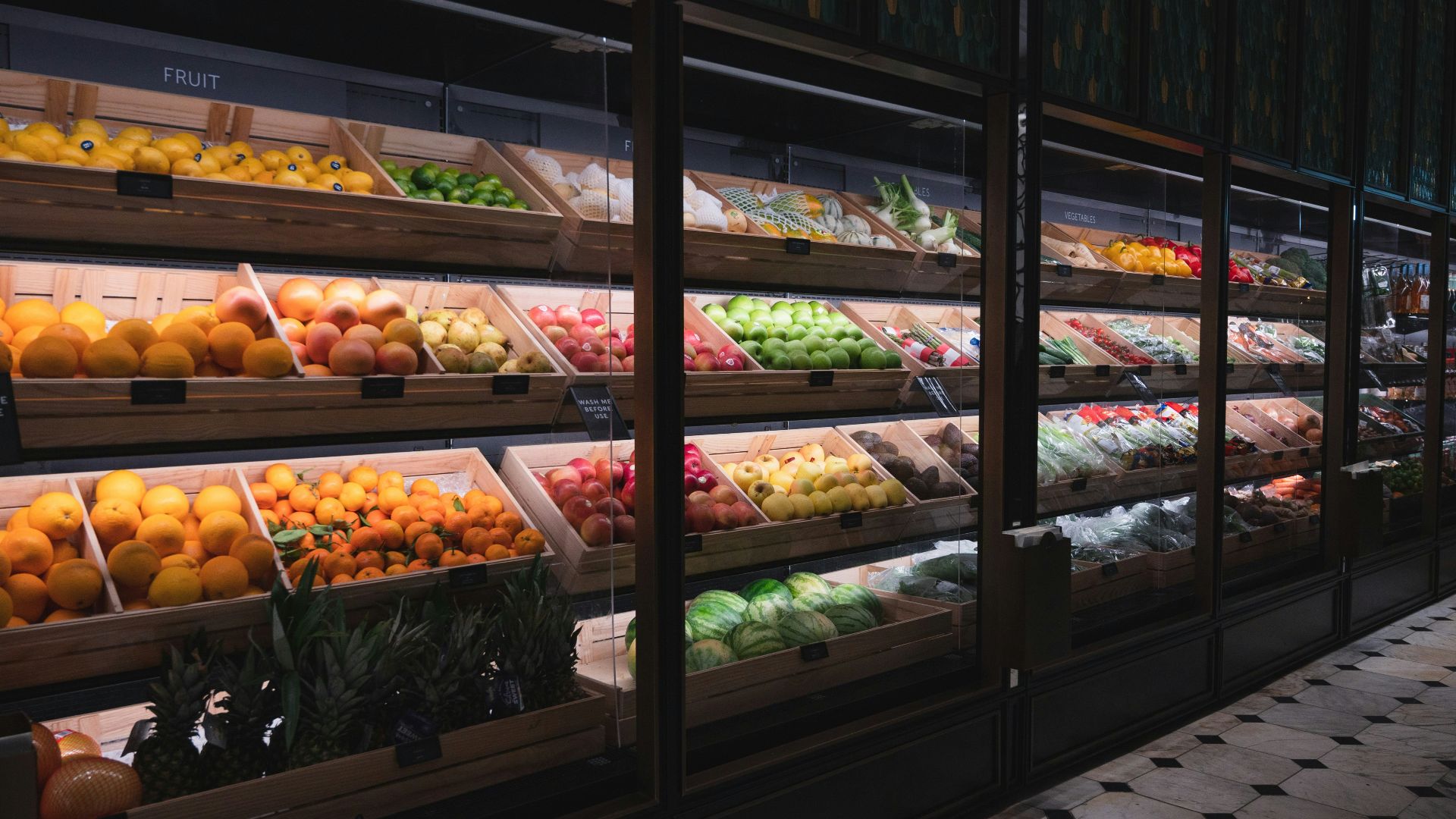a display in a grocery store filled with lots of fruit