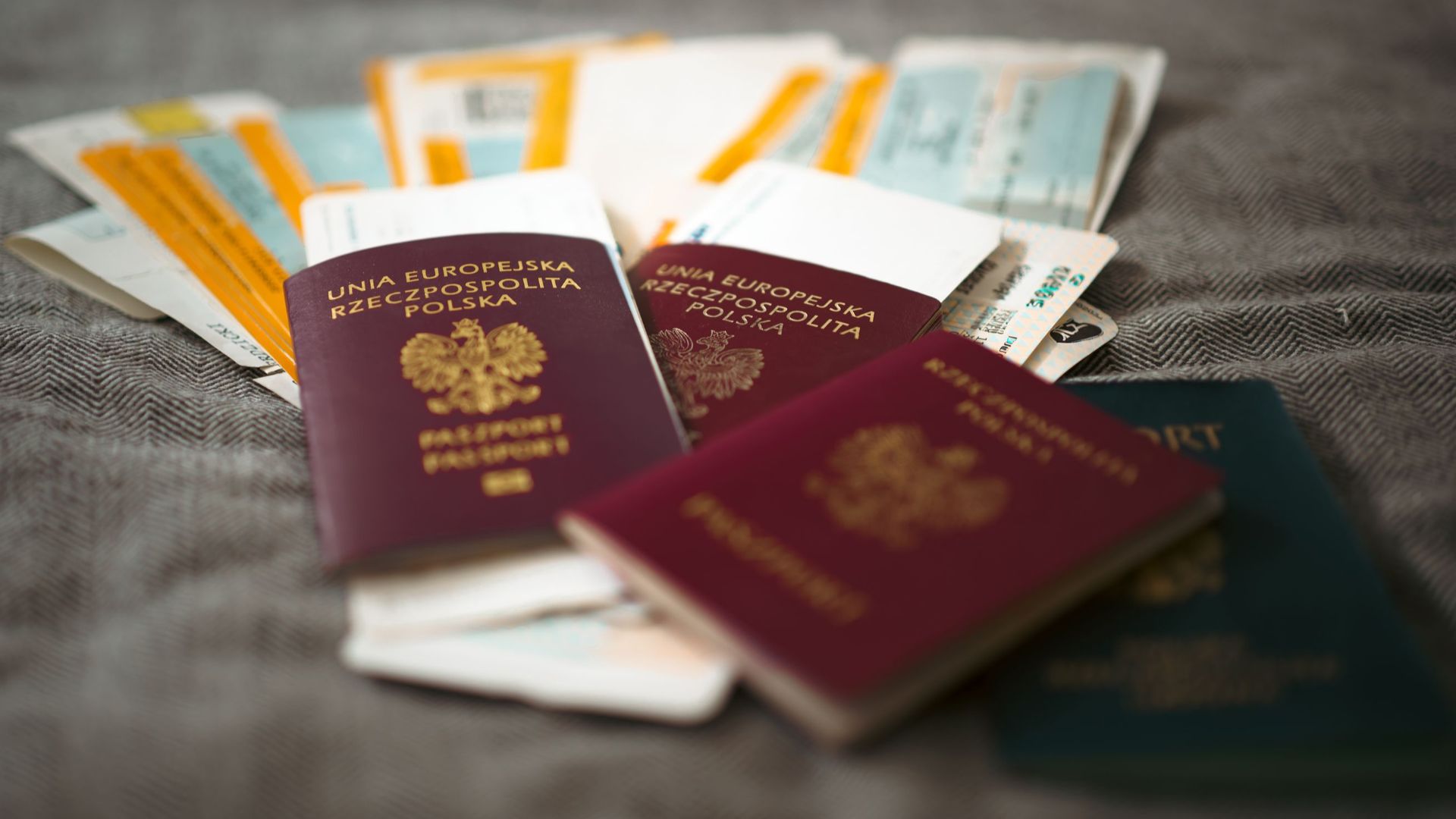 Close-up of Polish passports and travel tickets symbolizing travel and adventure.