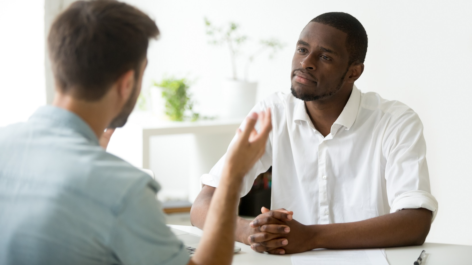 Two man are talking in the office, job interview.