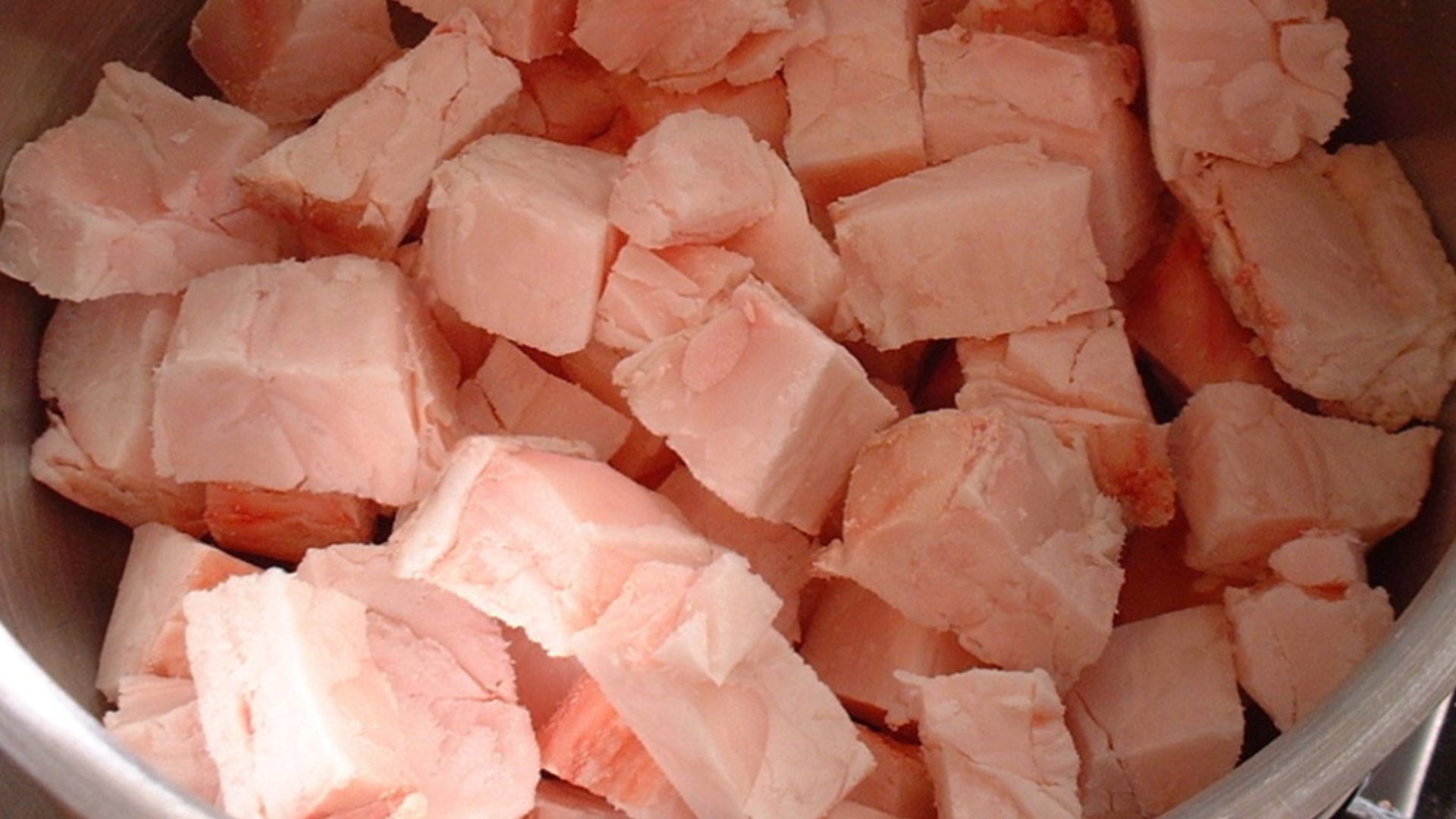 Slowly cook cubes of suet. (fat from the belly of a calf)