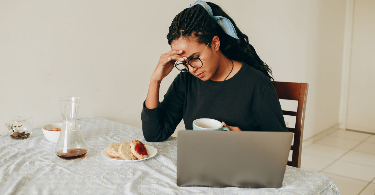 woman-watching-laptop-during-breakfast