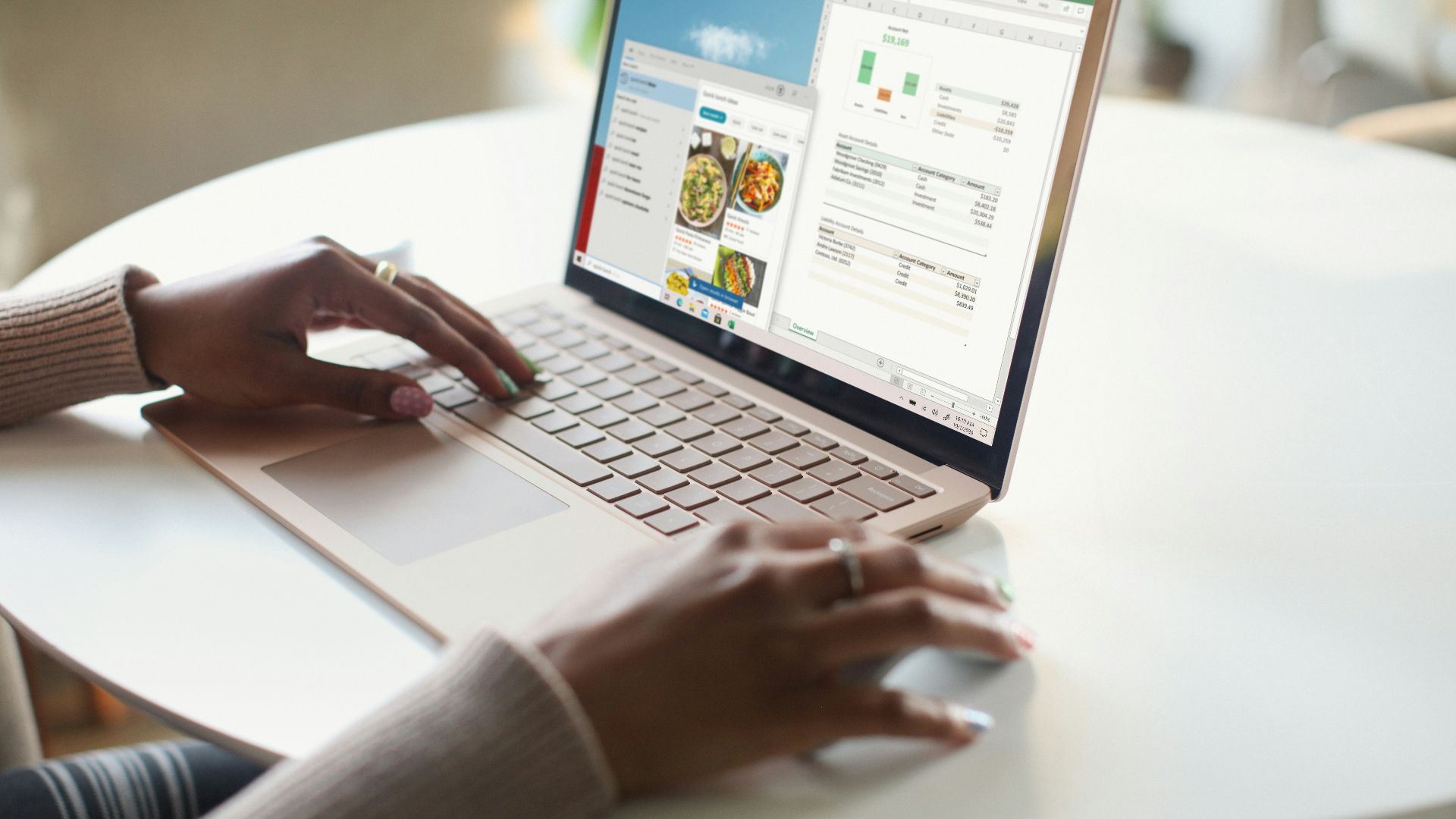 person in gray long sleeve shirt using Surface computer