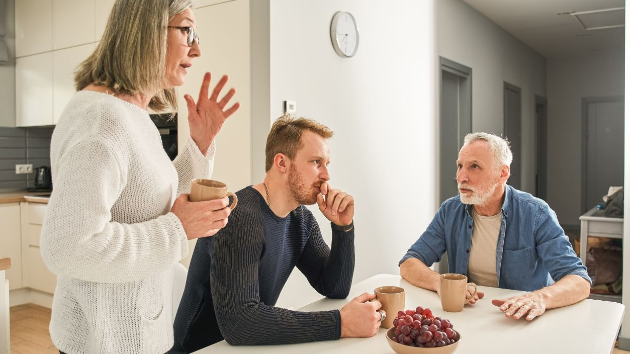 Shutterstock-2360194221, Emotional family of senior parents and son communicating at kitchen