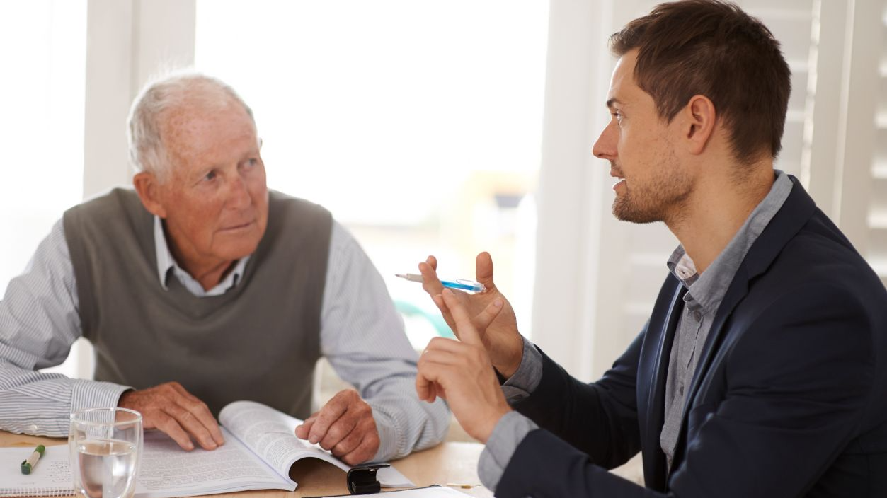 Shutterstock-2298734047, Financial advisor talking to a senior man with an investment, savings or retirement planning. Discussion, documents and professional accountant helping an elderly male person with finance paperwork.