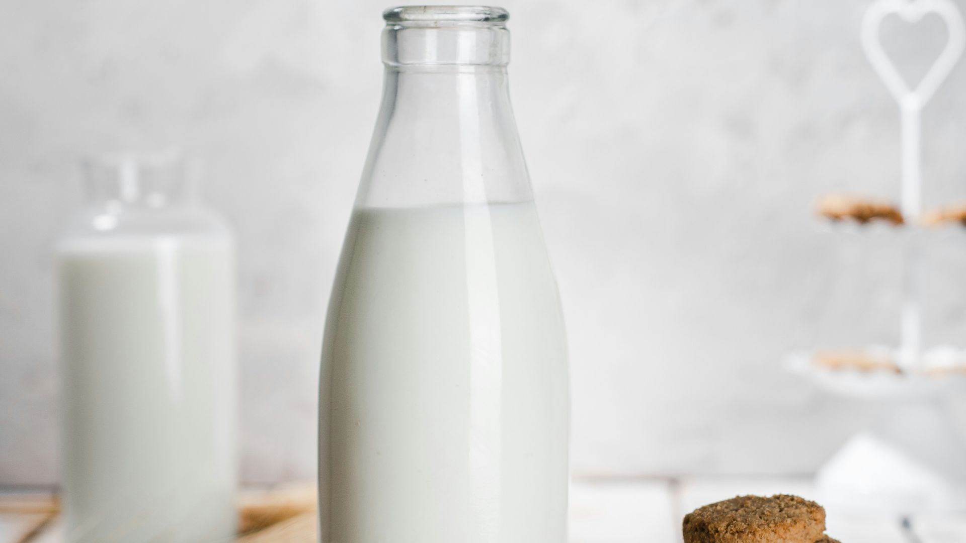 a bottle of milk and some cookies on a table