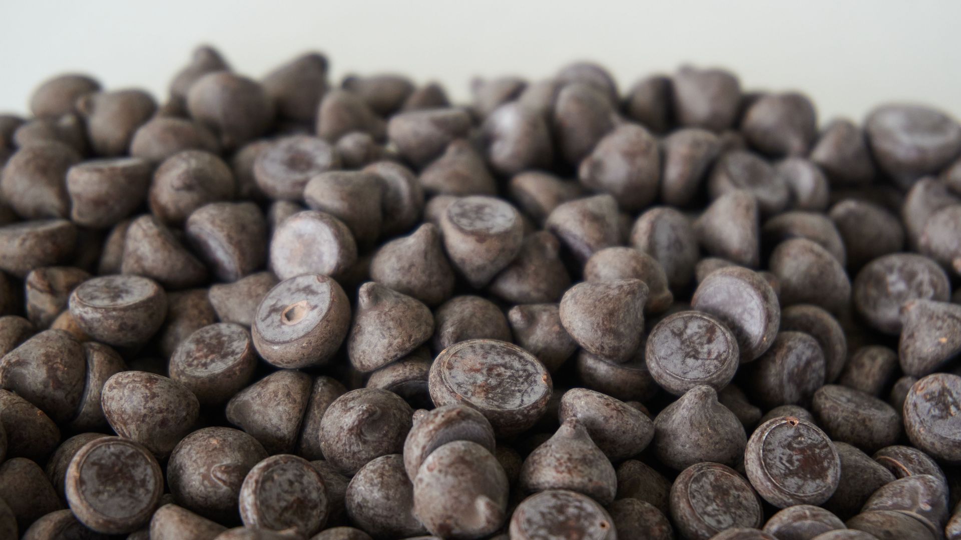 A detailed view of dark chocolate chips, perfect for baking needs.