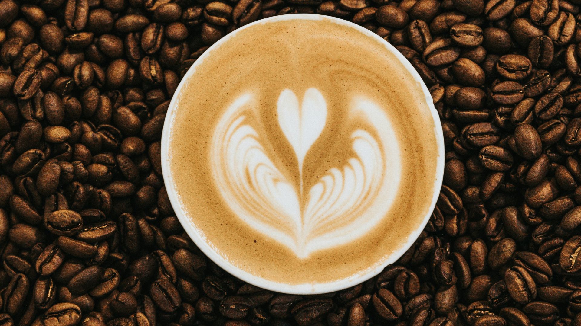 top view photography of heart latte coffee