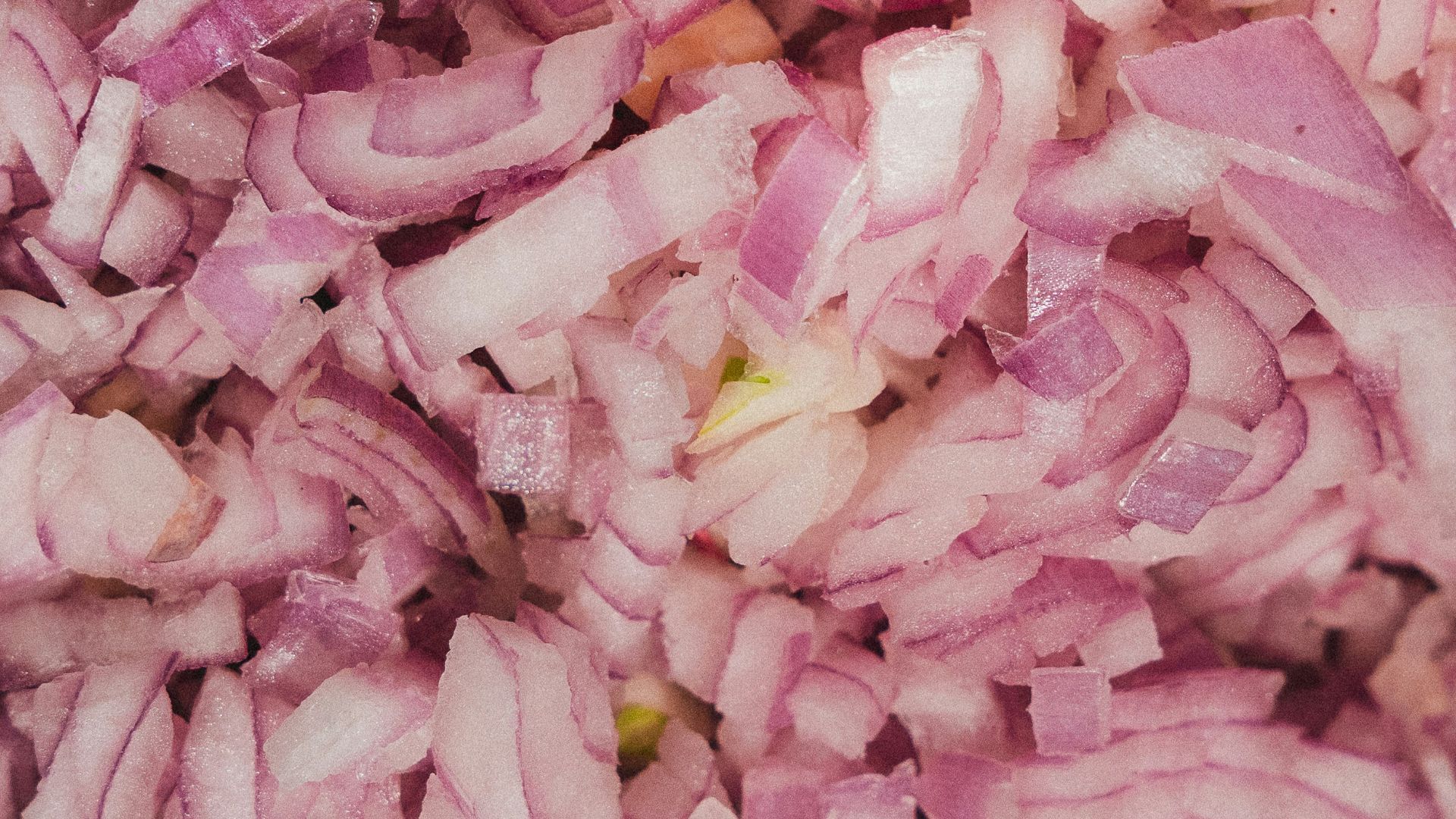 Finely chopped red onions ready for cooking