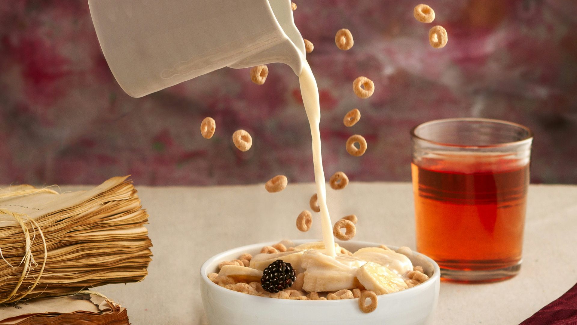 a bowl of oatmeal is being poured into a bowl