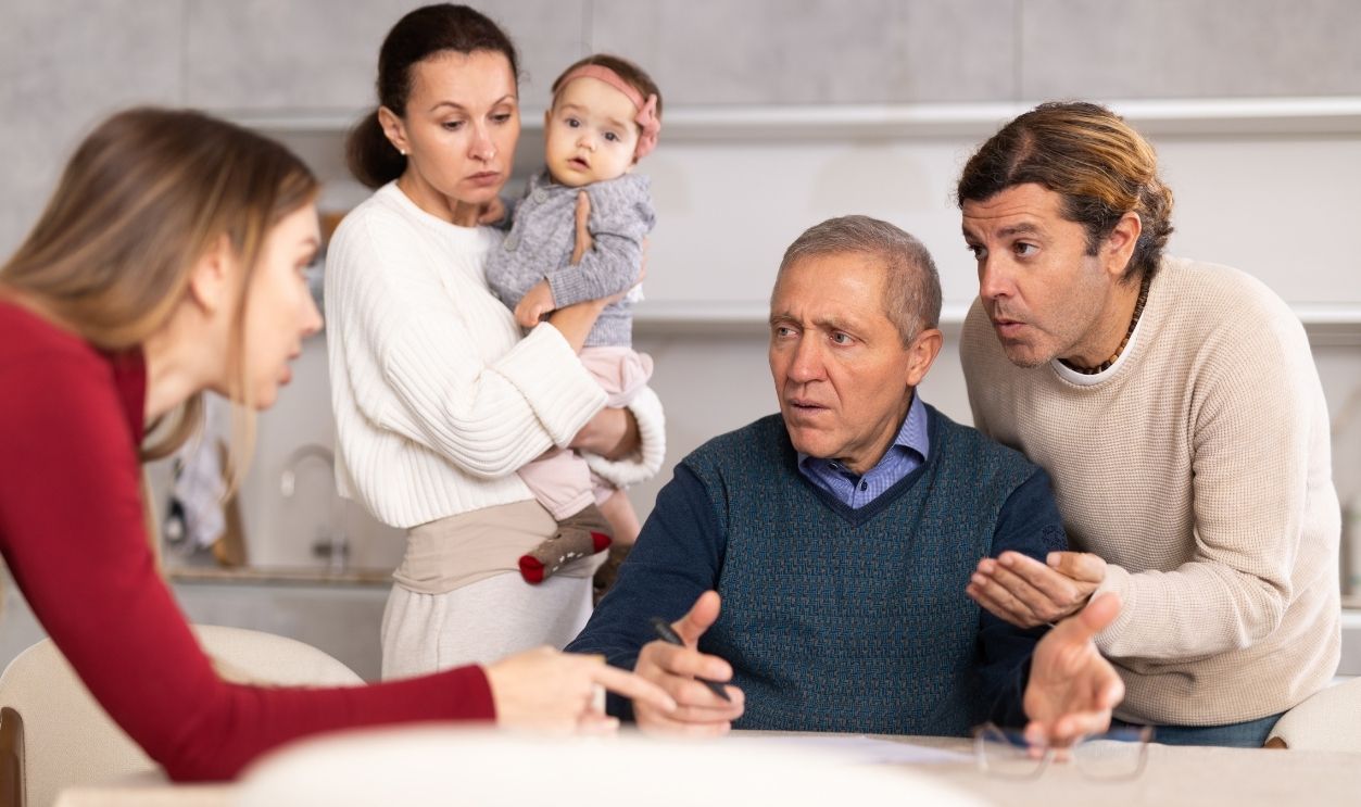 Family members giving advice to old man and discussing inheritance