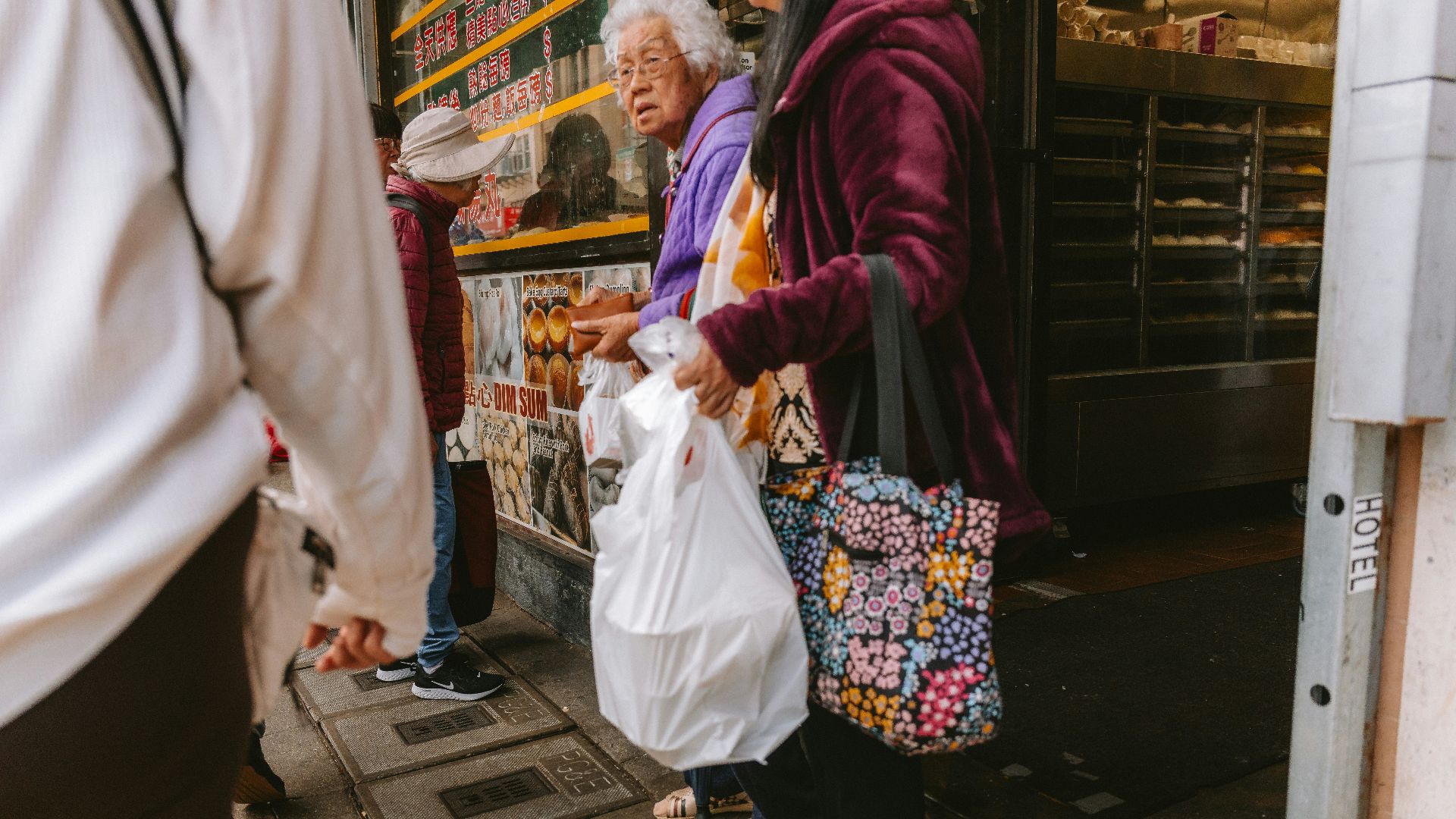 People are purchasing items from a shop