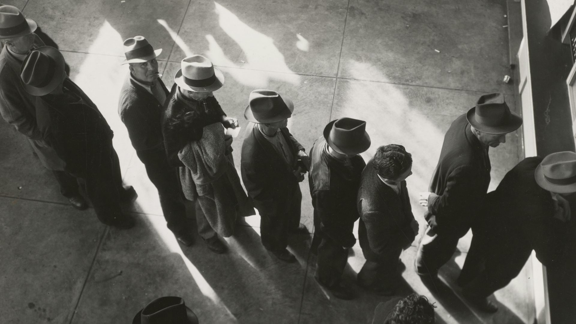 grayscale photography of people in line