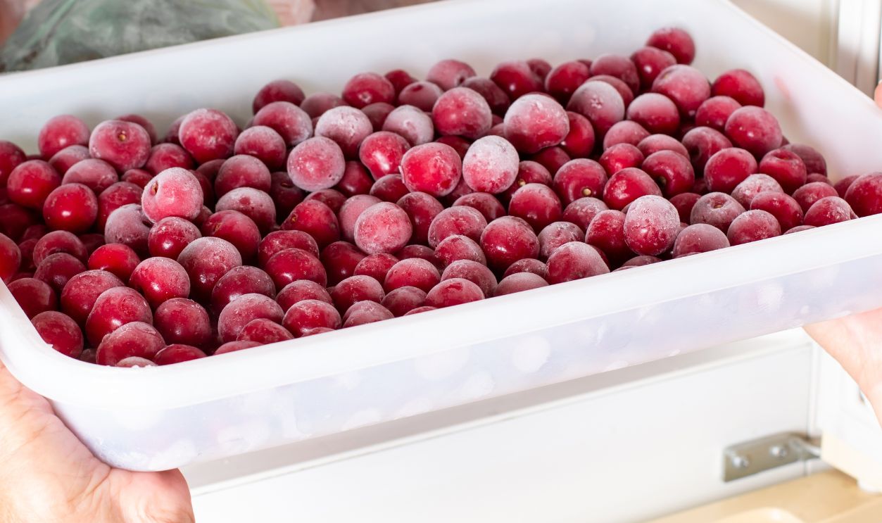 Frozen cherries in the freezer. Frozen food, frozen fruit