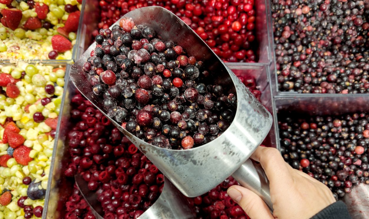 buying  frozen fruits and  berries ( cranberries, currants)at the market
