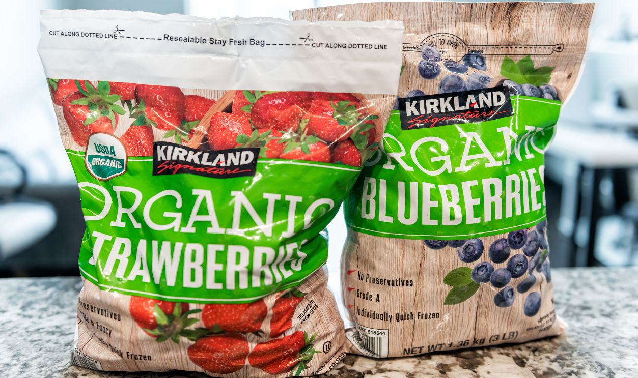 Avon, USA - November 28, 2022: Organic package of frozen strawberries berry fruit bought at Costco by Kirkland bulk food brand blueberries
