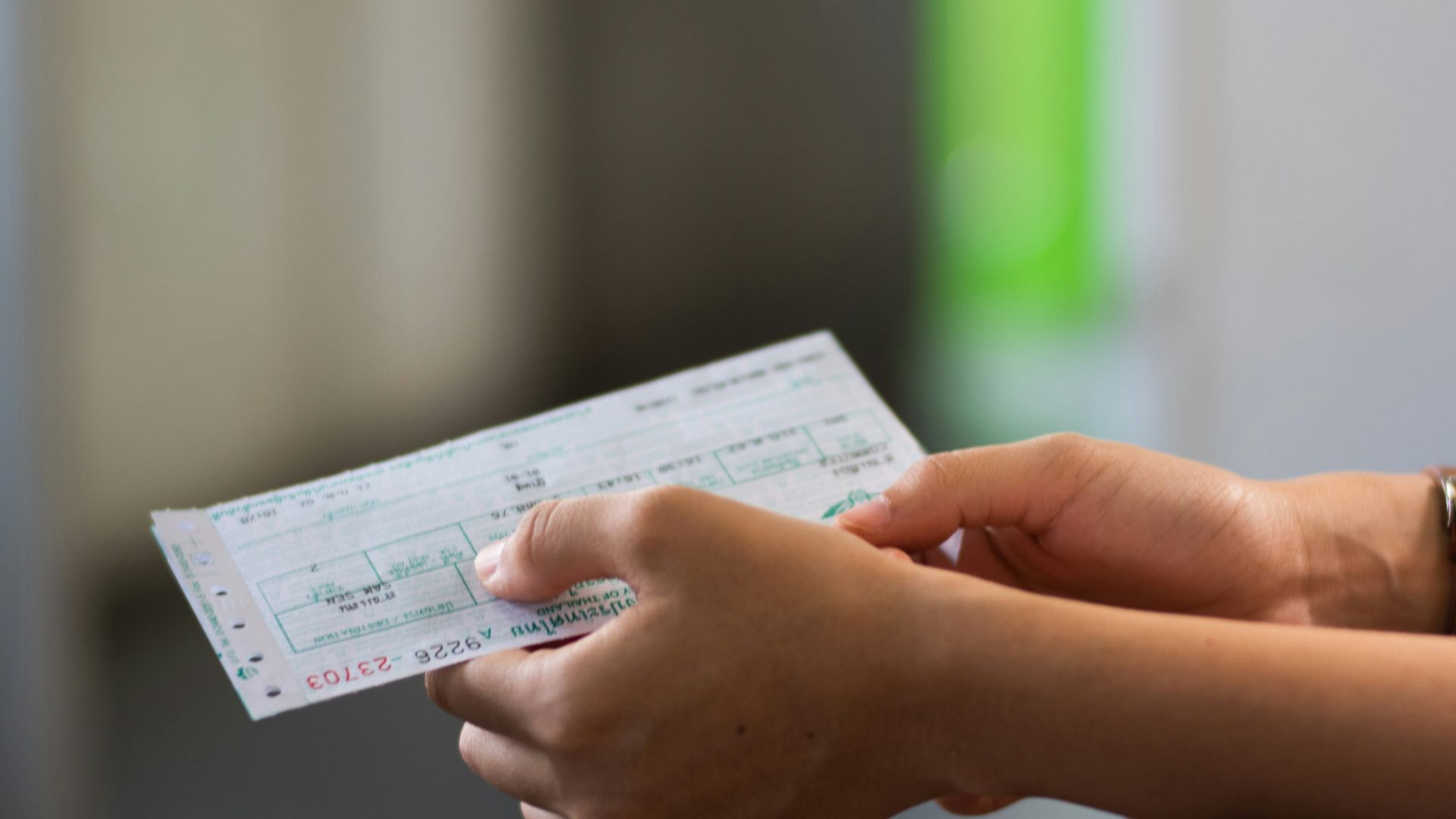 person holding white printer paper