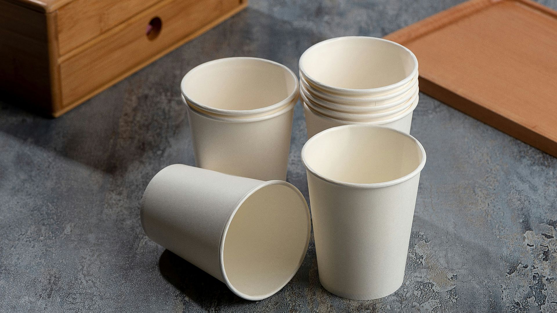 a cup of coffee sitting on top of a wooden table