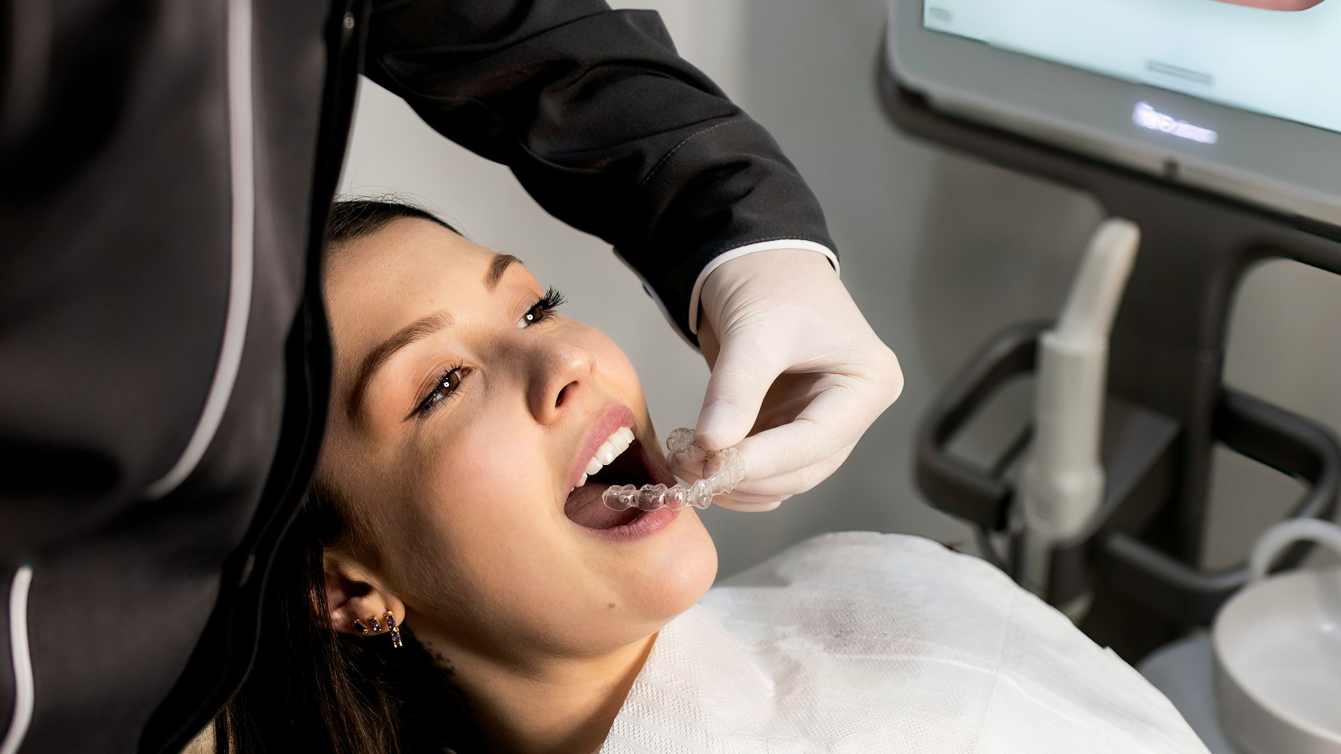 dentist examining patient with dental scanner