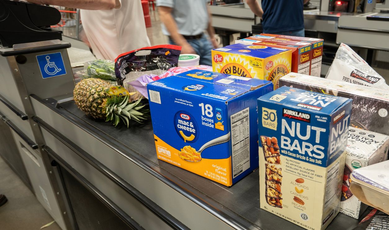 Tigard, OR, USA - Mar 24, 2025: Staffed checkout lanes at a Costco store in Tigard, Oregon. Costco Wholesale Corporation operates a chain of membership-only warehouse club retail stores.